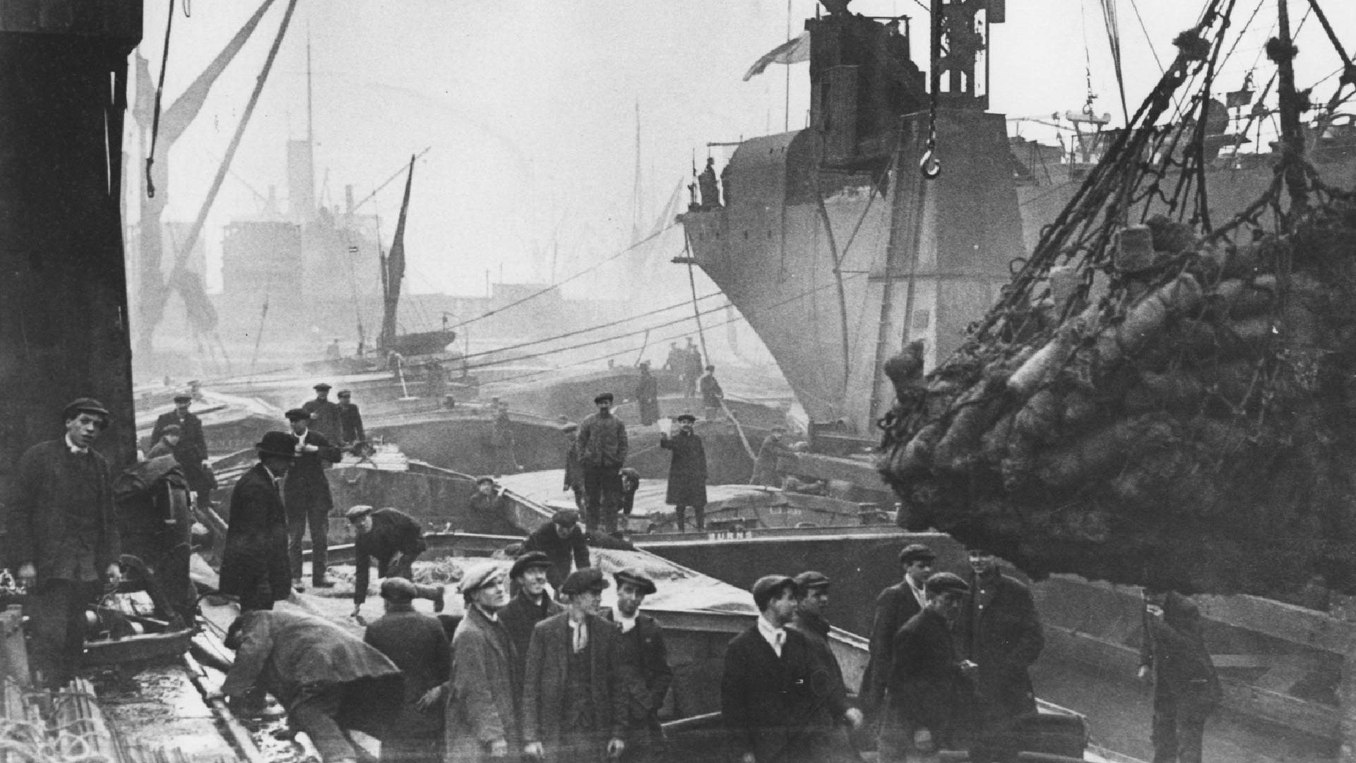 Men on dock cargo ships archive Coir at Millwall