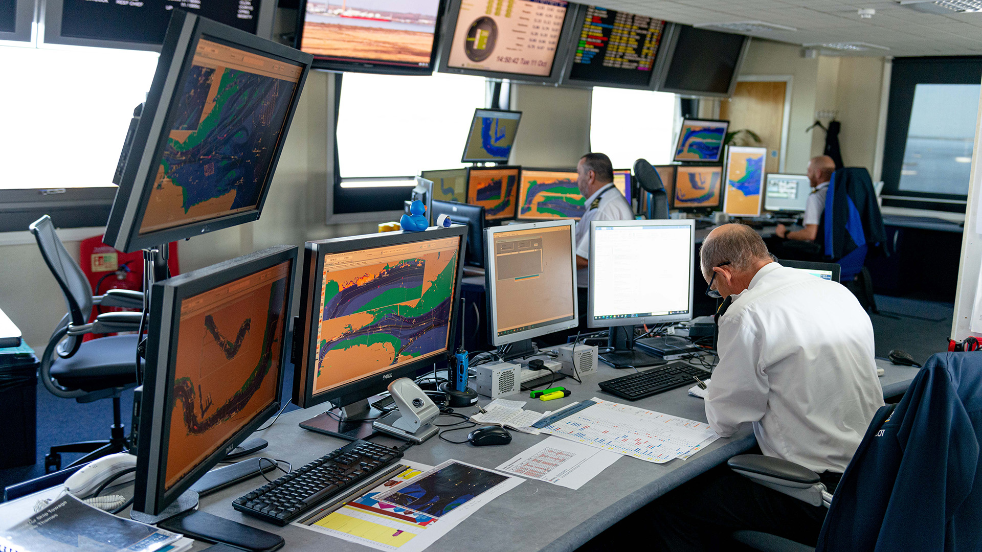 VTS Department with many screens on desks looking at river traffic