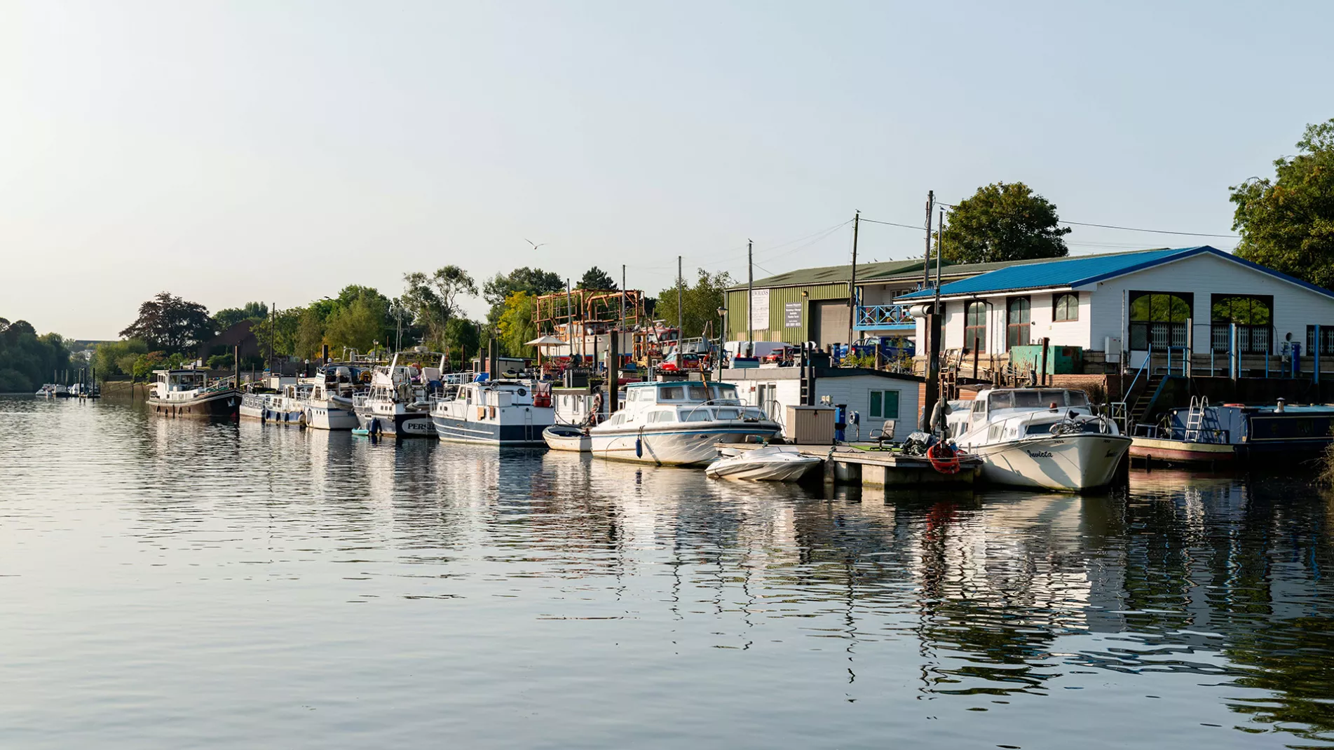 Boats moored along the tidal Thames