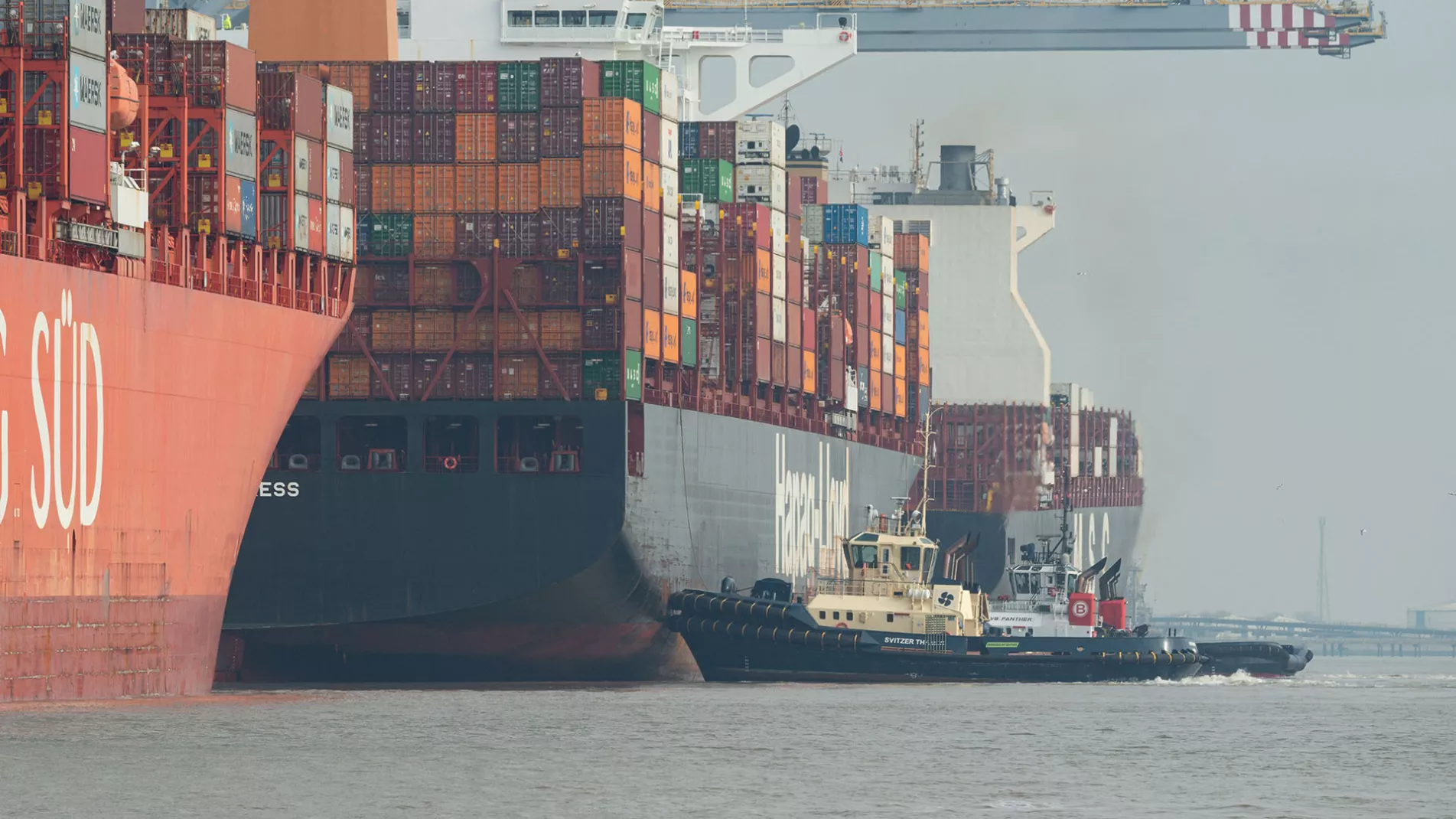 Vessels at London Gateway with a Svitzer and a Boluda tug