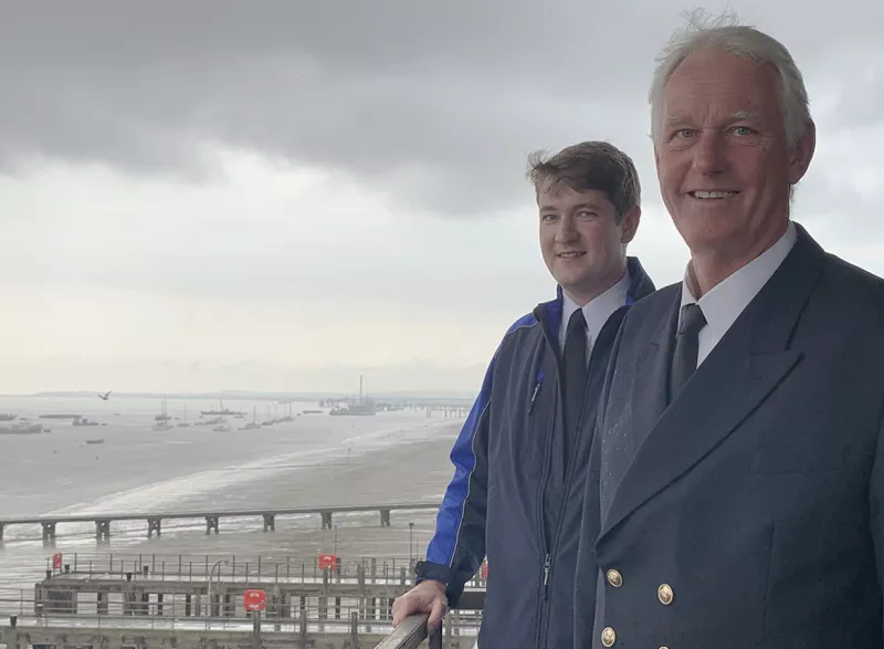 David and David Hocking, father and son who are both PLA Pilots with the Thames in the background