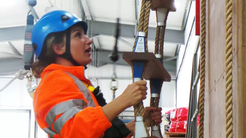 Thames apprentice Scarlett Barnett-Smith on a training ladder