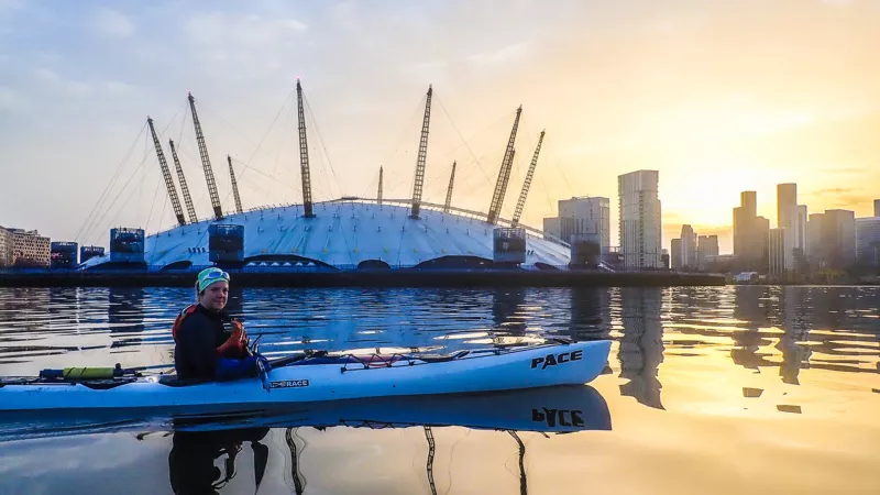Natalie Maderova on a kayak with the O2 Arena in the background People of the Thames