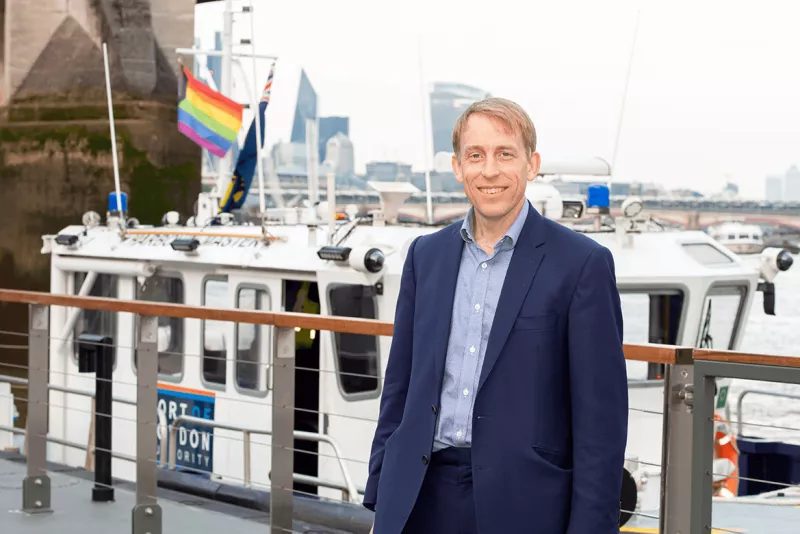 PLA CEO Robin Mortimer with vessels and Pride flag